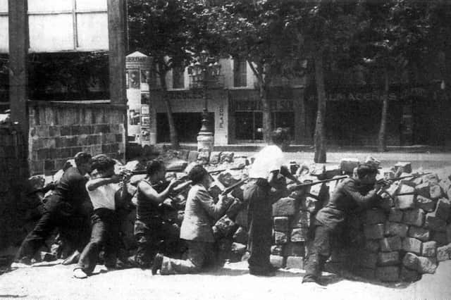 A CNT barricade on The Ramblas in Barcelona during the May Days of 1937