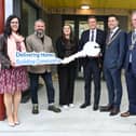 Minister of State Browne presenting key to Staff of Aurora Disability Services who support residents of Group Residential Home in the development