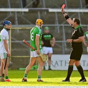 Danny Loughnane of O'Loughlin Gaels, left, is shown a red card by referee Owen Beehan during the 2021 Kilkenny County Senior Club Hurling Championship Final at UPMC Nowlan Park in Kilkenny. 
