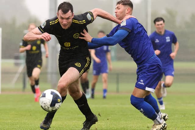 Callum Warfield of CK United in action against Ethan Mills of Newbridge Town during the FAI National League game earlier this season.