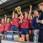 Dicksboro players Aobha O'Gorman and Tara Clifford life the cup