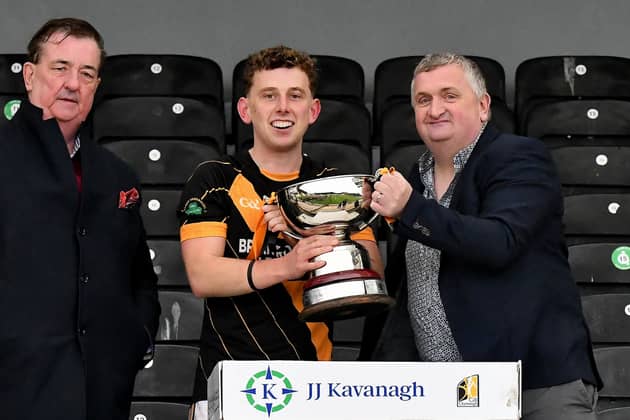 Conahy captain Ciaran Rice receives the junior trophy from Pj Kenny (Chairman) and Paul Kavanagh (Sponsor).