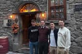 Irish cycling stars Dillon Corkery, Eddie Dunbar and Sam Bennett pictured during their visit to Kyteler's Inn in Kilkenny with Director of Kyteler’s Inn, JD Flynn