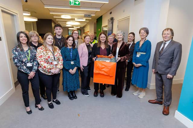 County Librarian Josephine Coyne and library staff present An tUachtarán, Catherine Connolly with a gift of a Cushendale limited-edition throw
