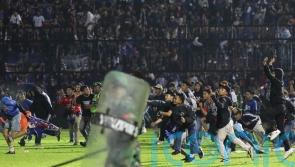 At least 174 people reportedly dead after stampede at football match