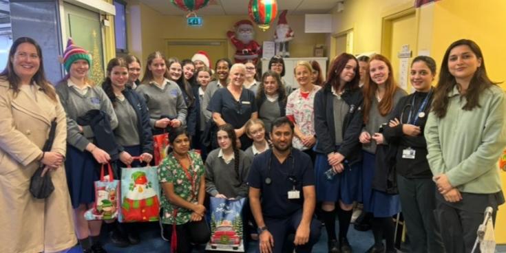 Loreto students bring toys to the children in St Luke's