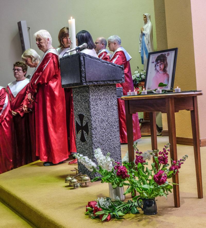 Rita Apine remembered at prayer service as 'a woman with a strong spirit' and 'full of love'