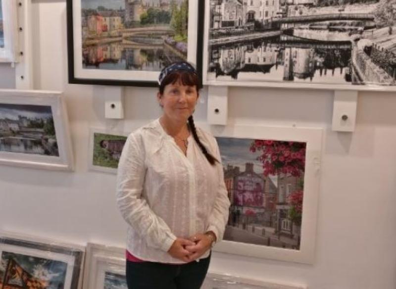 Photographer Vicky Comerford at her own  fantastic exhibition on Kieran Street, Kilkenny during the arts festival