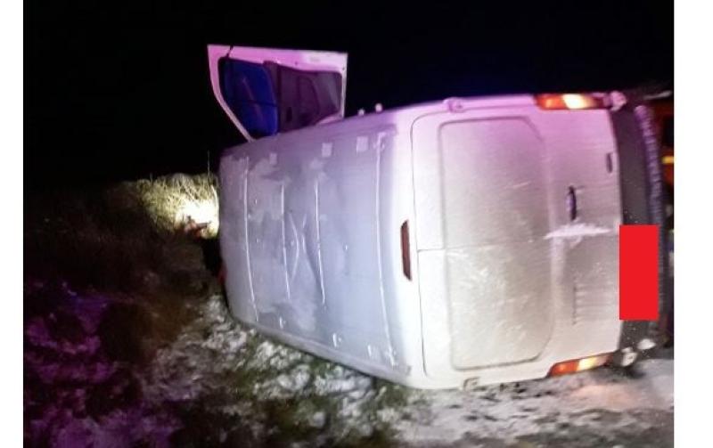 PHOTOS: Driver rescued from overturned van in icy conditions 