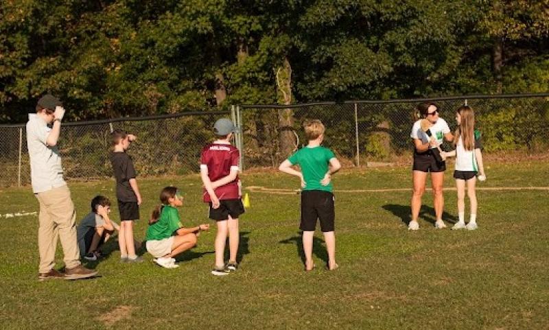 Glenmore woman Sarah Holland demonstrates how to play hurling, with local children from Raleigh North Carolina, at the first Irish Family Field Day organised by Le Chéile Irish community group