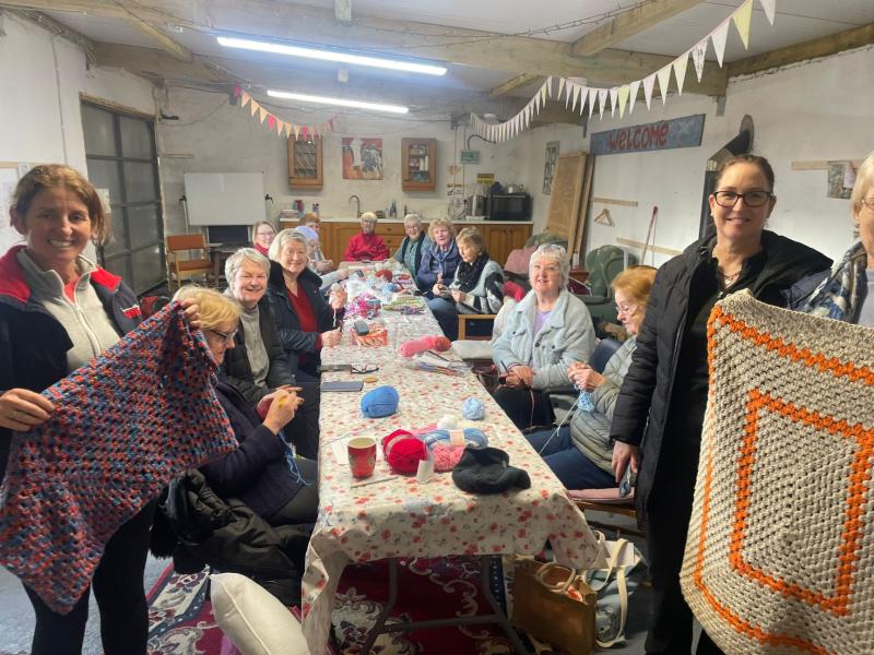 John Crowley with members of the Kilnaspic Sewing Group at Kilnaspic Peoples Shed who have made blankets for the children in an orphanage in South Africa Pictures: Joe Cashin