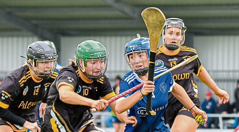 Champions Piltown march past St Brigid's and into Kilkenny Senior Camogie Final