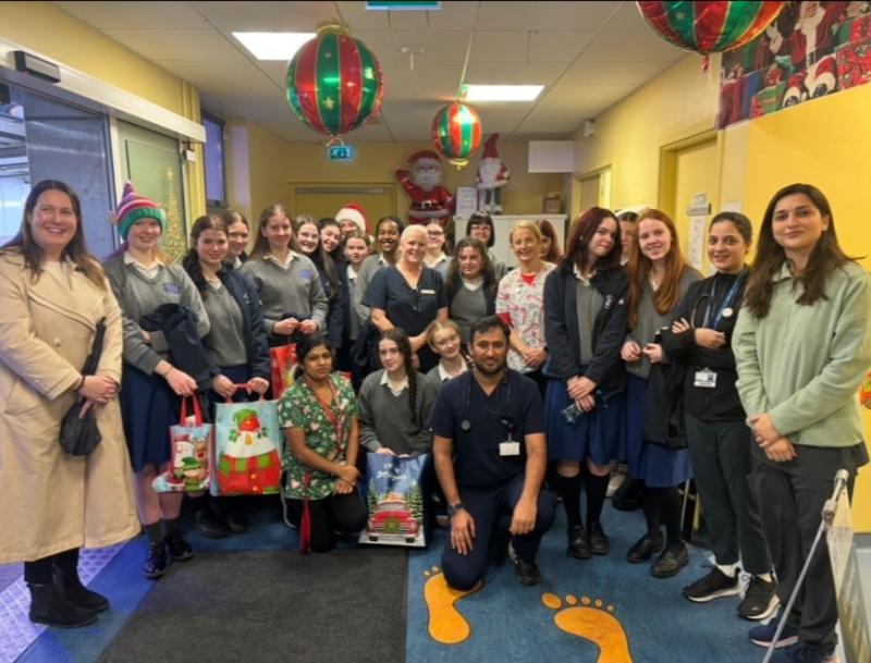 Loreto students bring toys to the children in St Luke's