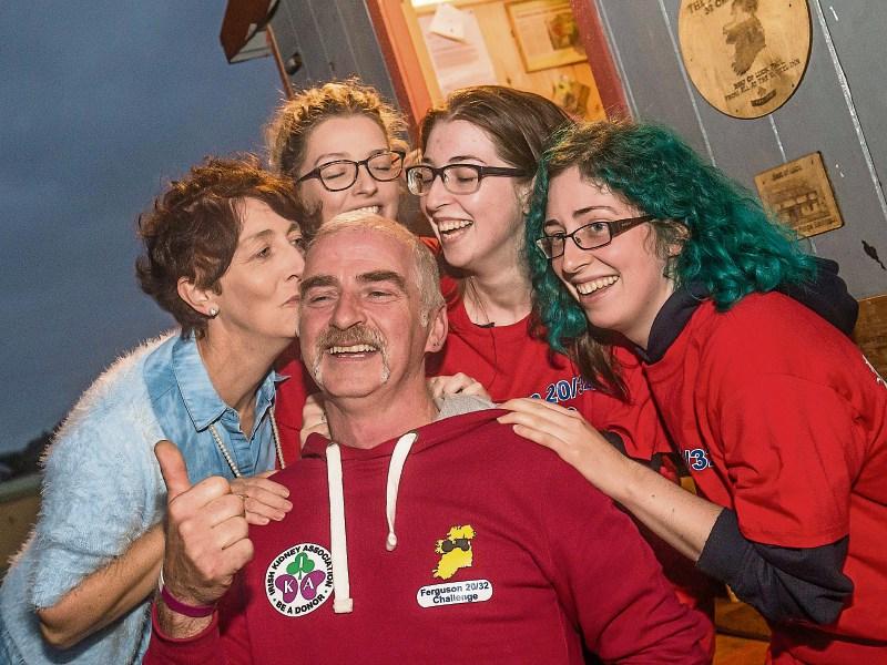 Paul Palmer being welcomed home to Ballyouskill by his wife Frances and daughters Gemma, Rachel and Grace