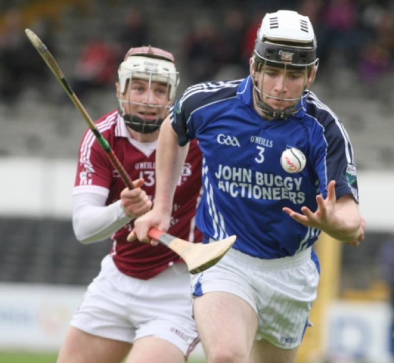 Padraig Keating (Erin's Own) keeps his eye on the sliotar as Ciaran Prendergast (Clara) closes in during the SHL clash in Nowlan Park. Photo: Eoin Hennessy