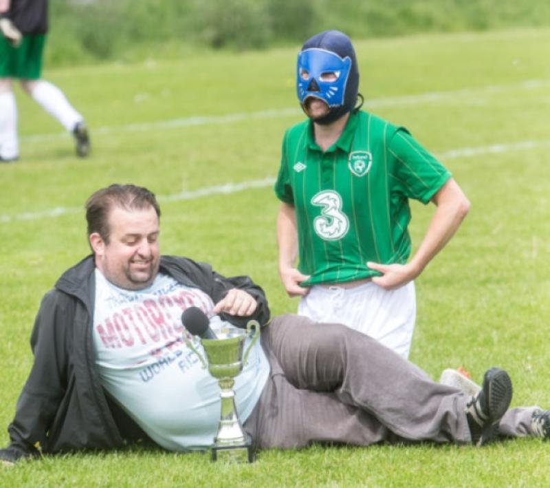 02/06/2013: Karl Spain and Andrew Maxwell tried some modelling during the Sky Cat Laughs Soccer match between Ireland and the Rest of the World in Kilkenny on Sunday afternoon. Photo: Pat Moore.