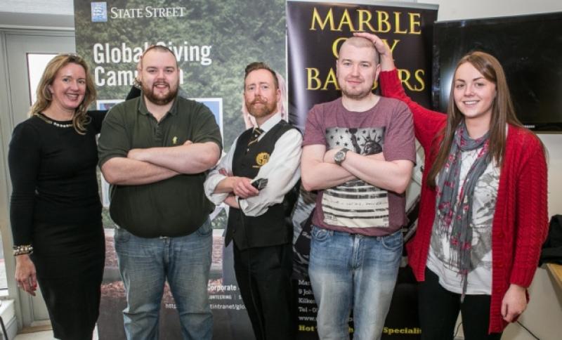 Shay Lawlor and Niall Bambrick who got their hair shaved by Mark Donegan to rais efunds for the Cois Nore Cancer Support Centre pictured with Aisling Gill and Kelly McNamara at State Street last Friday afternoon. Photo: Pat Moore.