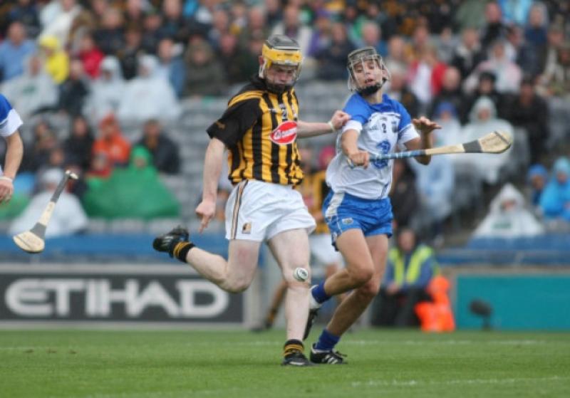 John Walsh (Kilkenny) keeps his eye on the sliotar as he gets ready to kick an extra-time goal, despite the best efforts of David Prendergast (Waterford), during the All-Ireland minor hurling semi-final in Croke Park. Photo: Eoin Hennessy
