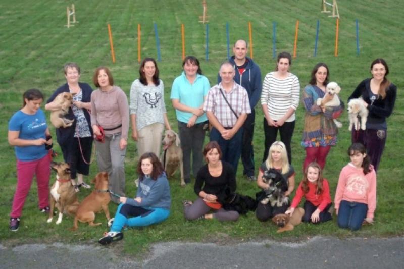 Mary Dargan, (centre) and members of the Kilkenny Dog Training Club at the evening session at the old Kilkenny scvout den. Picture: Michael Brophy.