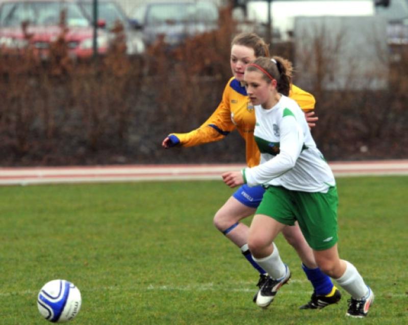 Olivia Nolan (Evergreen) edges ahead of Clodagh McDonald (Bridge United) in a race for the ball during the Womens Shield final in Scanlon Park on Sunday. Photo: Michael Brophy