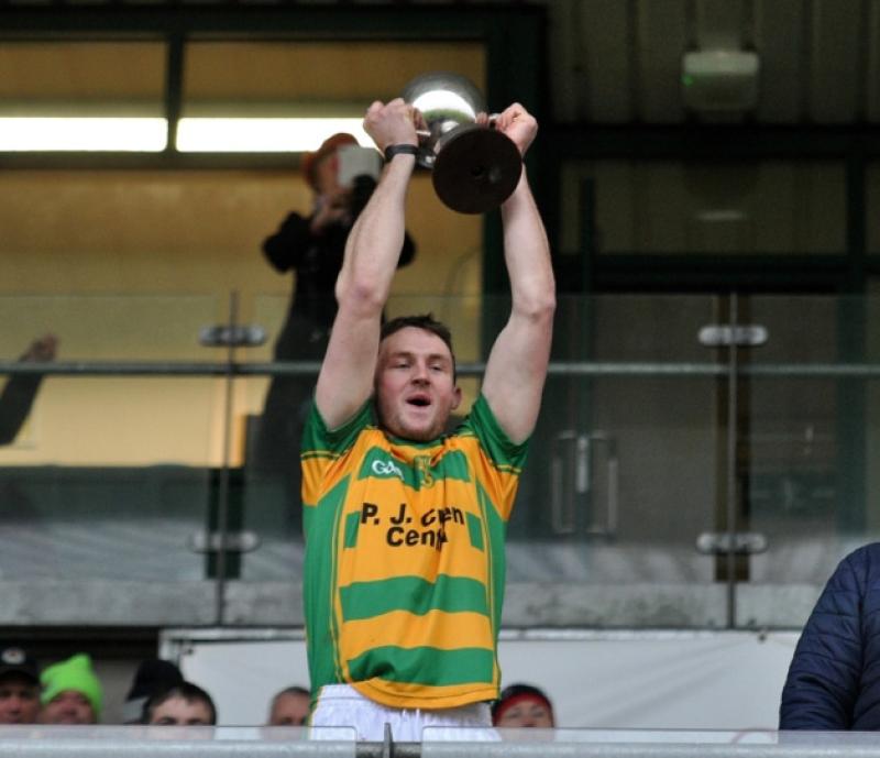 Robert Lennon lifts the trophy after Bennettsbridge won the Leinster junior hurling club championship. The Bridge will contest the All-Ireland final in Croke Park this weekend - the chance of a lifetime, according to their manager Christy Walsh.