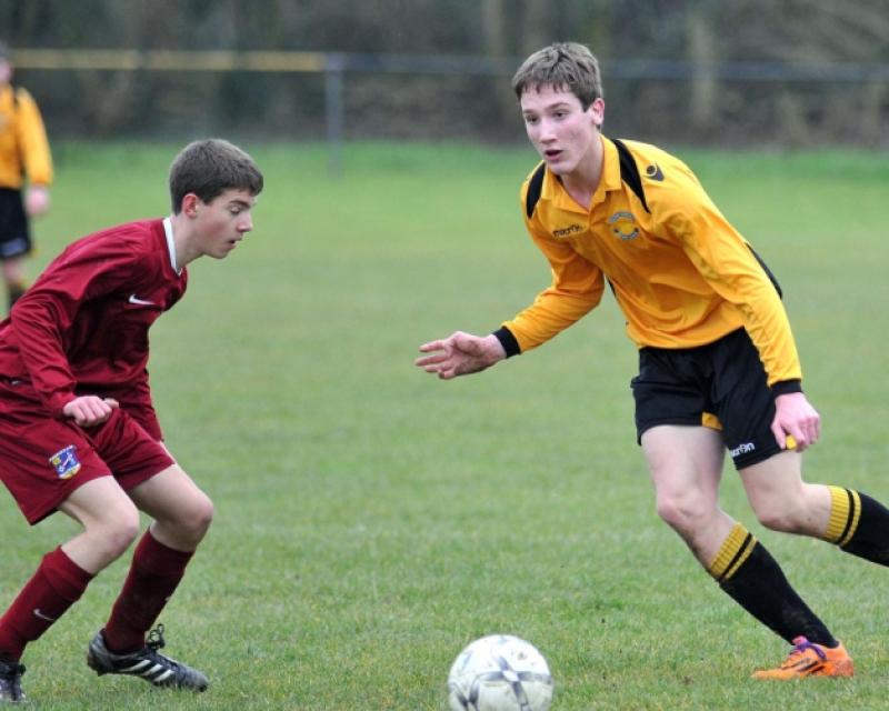 Cillian Power (Kilkenny) weighs up his options as Tommy O'Donovan (Kildare) looks on during the under-15 inter-league clash in Derdimus. Photo: Michael Brophy