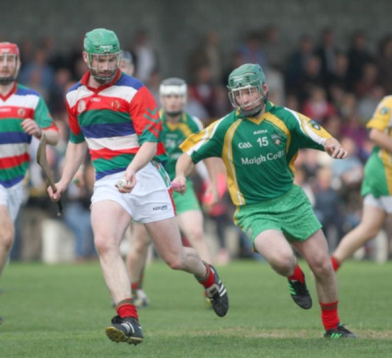 Donnacha Cody (James Stephens) keeps his eye on the sliotar as Robert Shore (St Martin's) closes in during their senior hurling quarter-final in Freshford. Photo: Eoin Hennessy