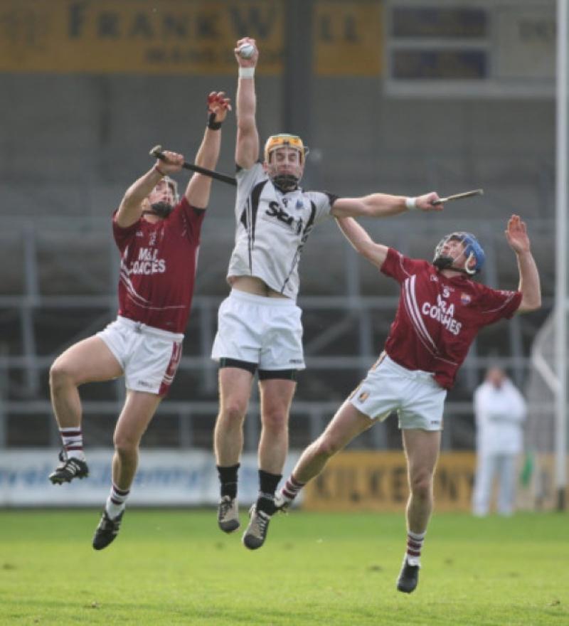 Dinny Butler (Mullinavat) raises his hand to catch the sliotar from Joe Brennan and Brian 'Brook' Phelan (St. Patrick's) during the Intermediate Hurling County Final in Nowlan Park. (Photo: Eoin Hennessy)