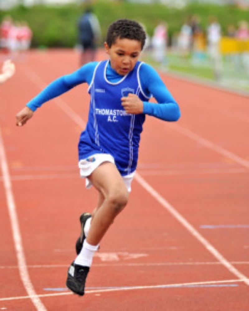 Jordan Knight (Thomastown AC) crosses the line to win the boys under-11 60m sprint during the second day of the county athletics championships in Scanlon Park. Photo: Michael Brophy