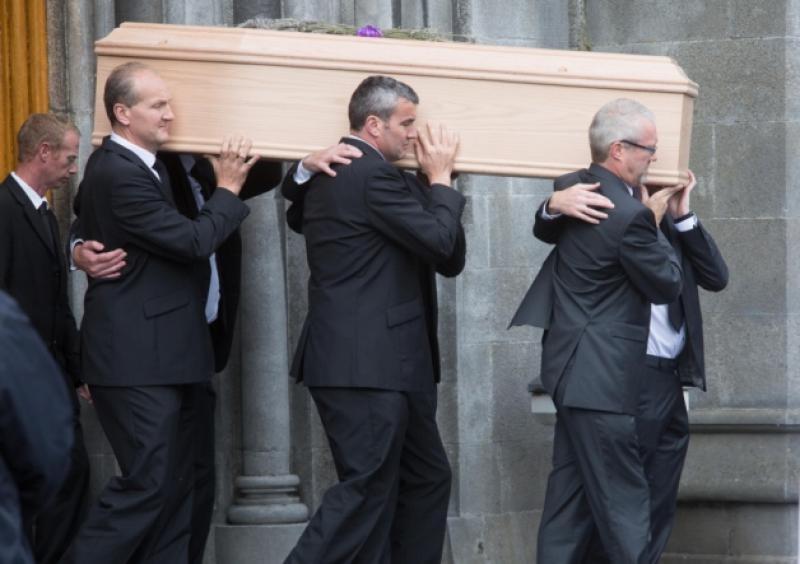 John Bolger's sons carry his coffin from St Mary's Cathedral.