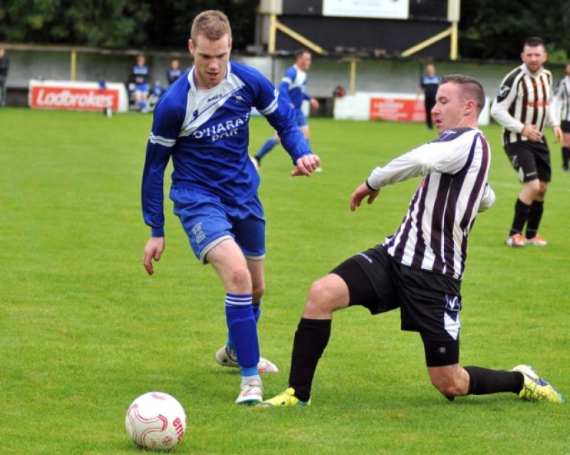 Stephen Dawson (Newpark A) slides in to try and stop Steven Connolly (Thomastown United A) during their Premier Division clash in Buckley Park on Sunday morning. Photos: Michael Brophy
