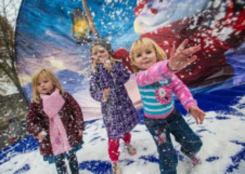 All set for 'A Very Kilkenny Christmas'! Local girls Mia Hoban (3) and her cousins Molly (5) and Masie Hoban (3) pictured in the Snow Globe at Polar Parade during the opening of 'A Very Kilkenny Christmas' last Sunday afternoon. Photo: Pat Moore.