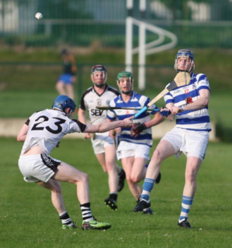 Aaron Fogarty (Lisdwoney) gets his clearance away as Brian Phelan (Mullinavat) closes in during the IHL clash in St. John's Park.  (Photo: Eoin Hennessy)