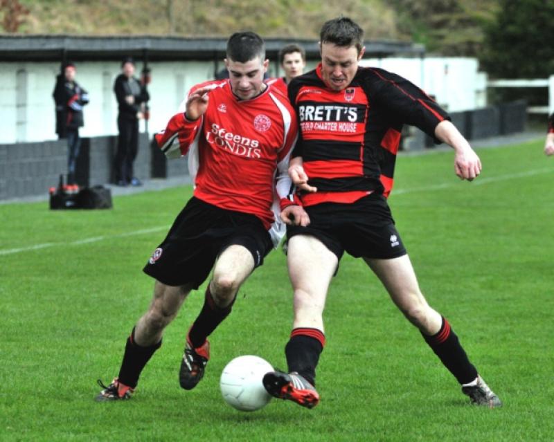 John J. Egan (right), seen here in action against Deen Celtic's Peadar Boran, has played a big part in Callan United's march to the McCalmont Cup final. Photo: Michael Brophy